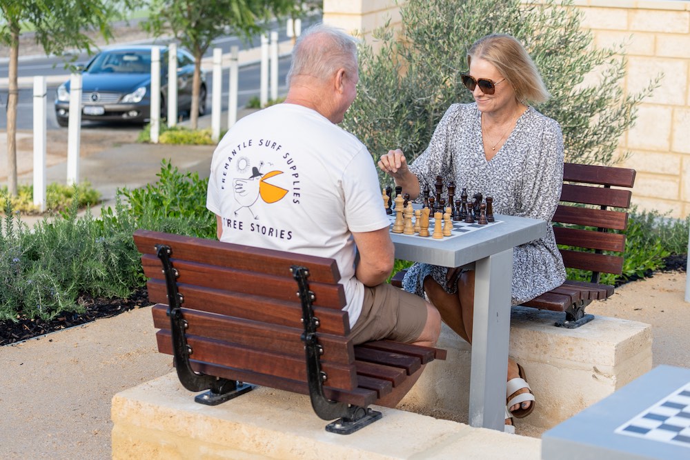 jindee couple playing chess park jindalee land for sale
