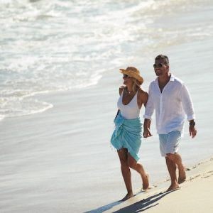 jindee couple walking on beach close up jindalee land for sale